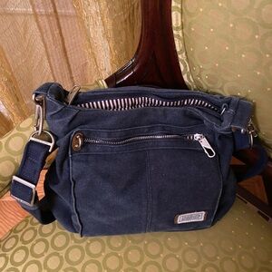 Travelon grey denim bag with secured zipper pockets